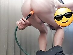 Using a garden hose to wash my ass outside hopefully someone will catch me